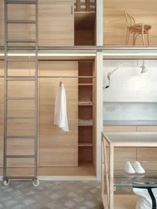 A modern clothing shop featuring wooden furniture and materials.