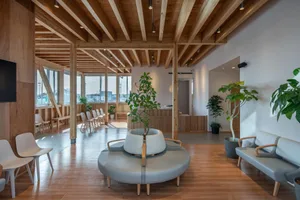 Modern lobby area with wood accents and seating arrangements.
