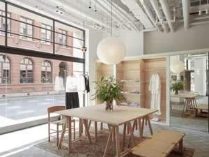 A modern retail shop featuring light wood elements and minimalist design.