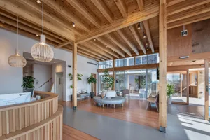 A modern office space featuring wooden materials and contemporary design.