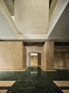 Modern office hallway with marble and concrete materials