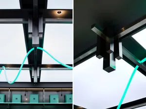 Metal beams and glass ceiling with LED lighting in an industrial design interior