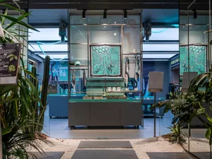 Modern retail storefront with glass walls and interior design elements.