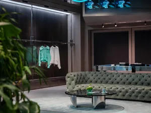 A modern retail space featuring metallic glass elements.