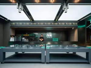 Modern retail storefront with a glass facade and sleek design