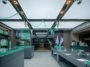 Industrial design retail storefront featuring glass and concrete materials