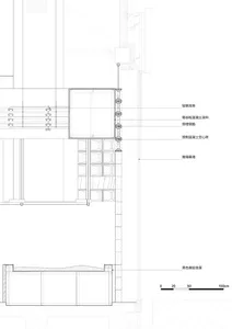 An architectural floor plan showing a section of a building with concrete and glass materials.