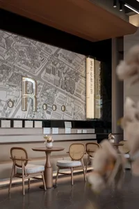 Modern cafeteria interior with wooden seating, glass panels, metallic accents, and a plaster wall displaying a detailed map o