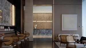 Modern hotel lobby with wooden accents and marble features