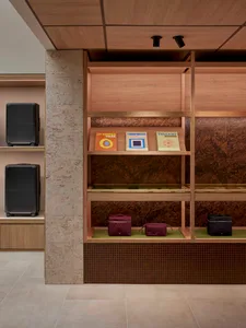 A modern retail shop featuring a combination of marble and wooden designs.