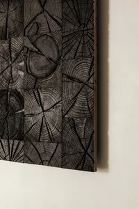 A textured wood panel with a rustic, industrial aesthetic.