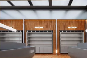 An empty storefront with metallic shelving units and a wooden paneled wall.