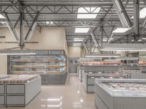 Modern grocery store featuring metallic grid shelving and high-tech illumination