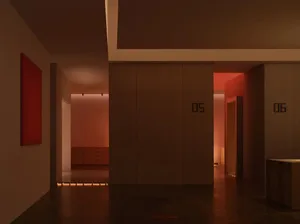 A modern interior with a red painting and light reflections on the floor.