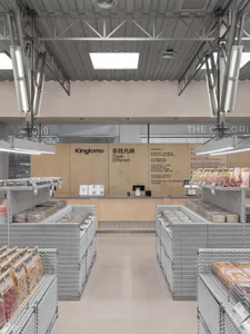 Modern retail space with metal and wood design elements on shelves and a counter.