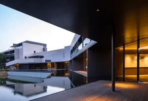 A modern building with glass and concrete exterior materials.