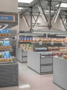 Modern grocery store interior with metal perforated panels and illuminated shelves