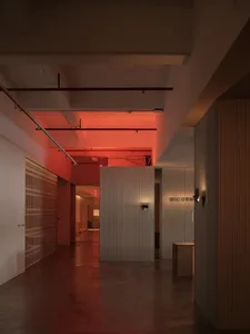 Modern industrial-style office space featuring a concrete panel on the wall