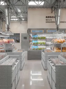 Modern grocery store with metal shelves displaying various products.