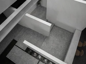 A minimalist, modern interior design featuring a concrete floor plan with clean lines and geometric elements.