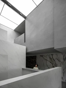 A modern Marble interior with high ceilings and skylights.