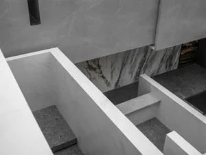 Modern interior with marble and concrete materials.