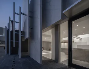 Modern office space featuring concrete and glass materials.