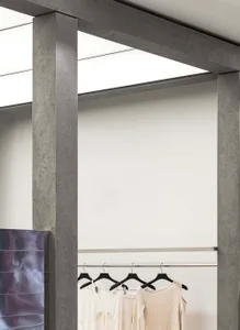 A clothing display featuring metallic hangers in a modern retail space.