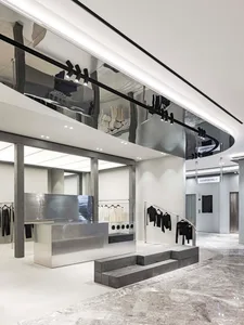 Modern retail storefront designed with glass, concrete, marble, and sleek lighting. Minimalist and contemporary design aesthe