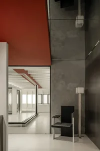 A modern interior space featuring concrete and metal materials.