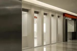 A modern retail space featuring metal-clad columns and spacious layout.