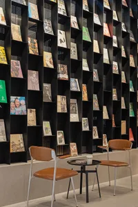A modern library featuring a bookshelf made of metal.
