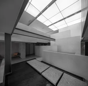 An image of a modern residential interior featuring concrete finishes.