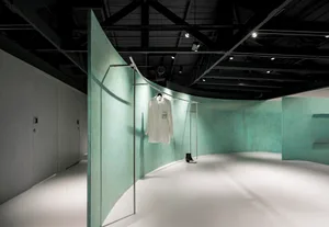Modern retail space featuring exposed concrete walls and minimalist design.