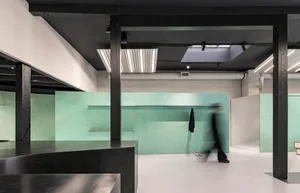 An industrial-style retail space with minimalist design elements and concrete walls.