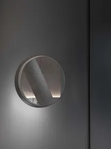 Modern interior design featuring contemporary lighting fixtures installed in glass wall panels.