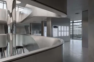 A modern office space with glass partitions.