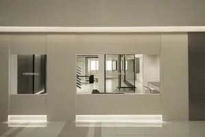Interior view of a modern office space showcasing concrete flooring and minimalist design.