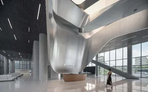 Modern office lobby featuring sleek metal and glass elements