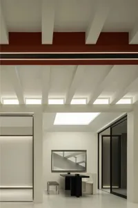 Contemporary interior space with exposed metal beams and a skylight