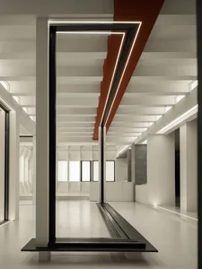 Modern lobby interior with concrete columns and lighting