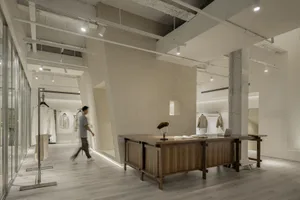 Modern retail store with concrete walls and minimalist design.
