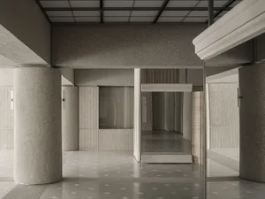 Modern interior space featuring concrete walls and flooring