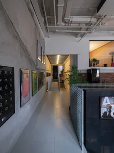 Modern office space with concrete walls and industrial lighting fixtures
