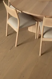 Modern dining room featuring wooden furniture and flooring