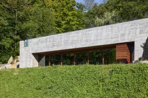 A modern house extension with a concrete exterior.