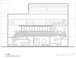 The exterior of a modern house with large glass windows, brick walls, a concrete patio, and wooden accents.