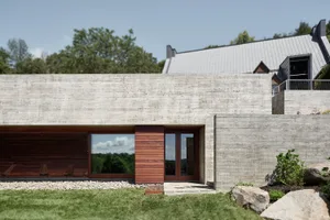 Modern architectural building with concrete exterior and wooden accents