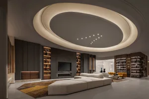 Modern industrial living room with metallic accents, featuring a futuristic ceiling and contemporary furniture.