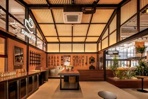Industrial storefront with wooden and glass elements, showcasing a modern retail design